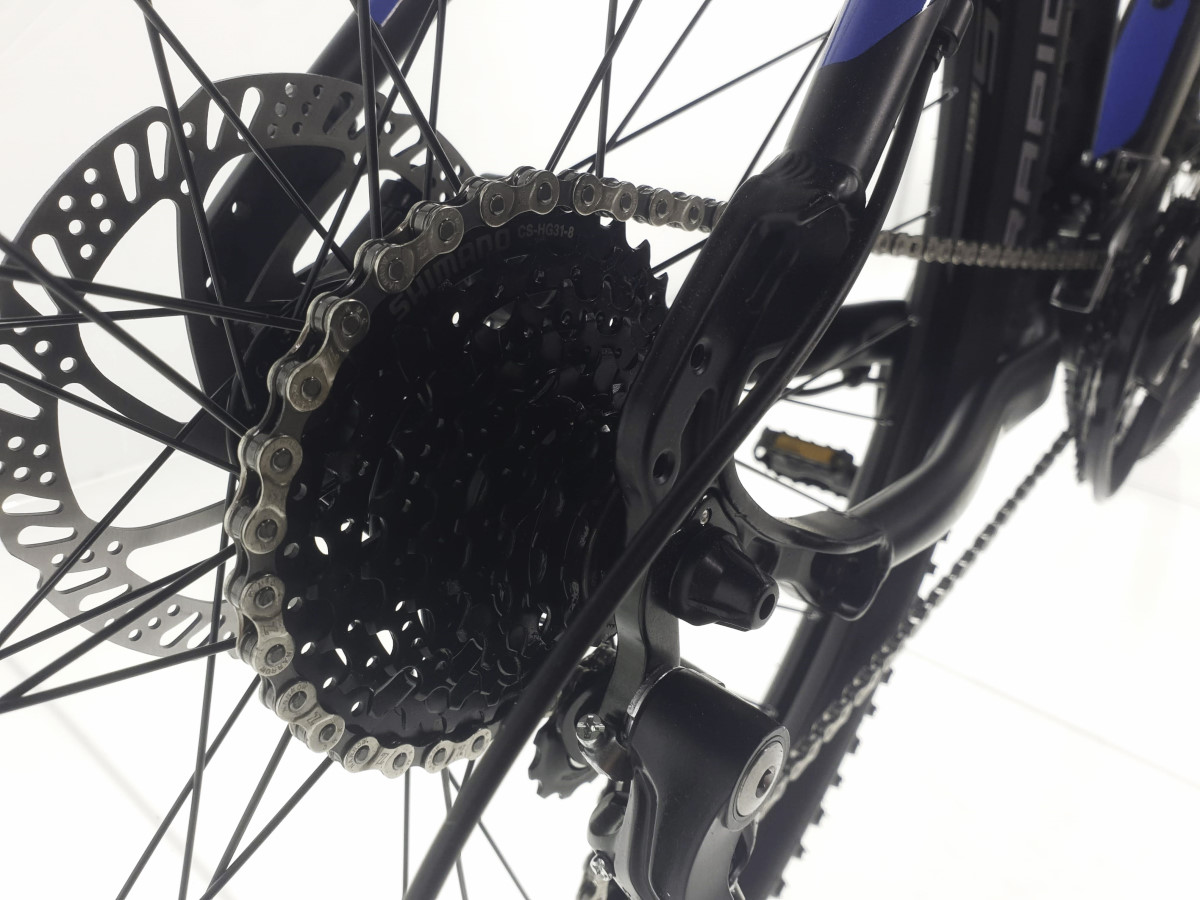 Close-up of a bicycle's drivetrain components.