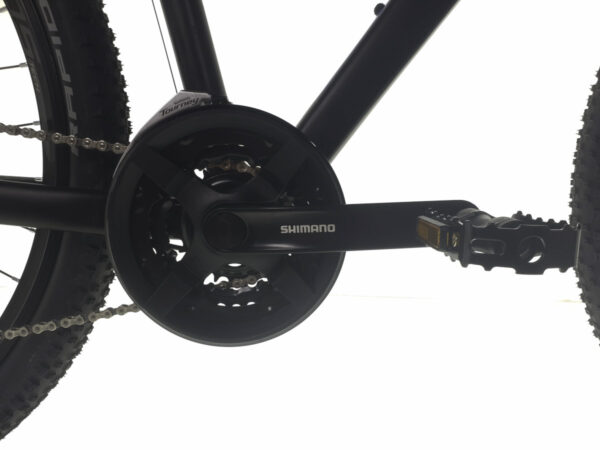 Close-up of Shimano bicycle crankset and pedals.