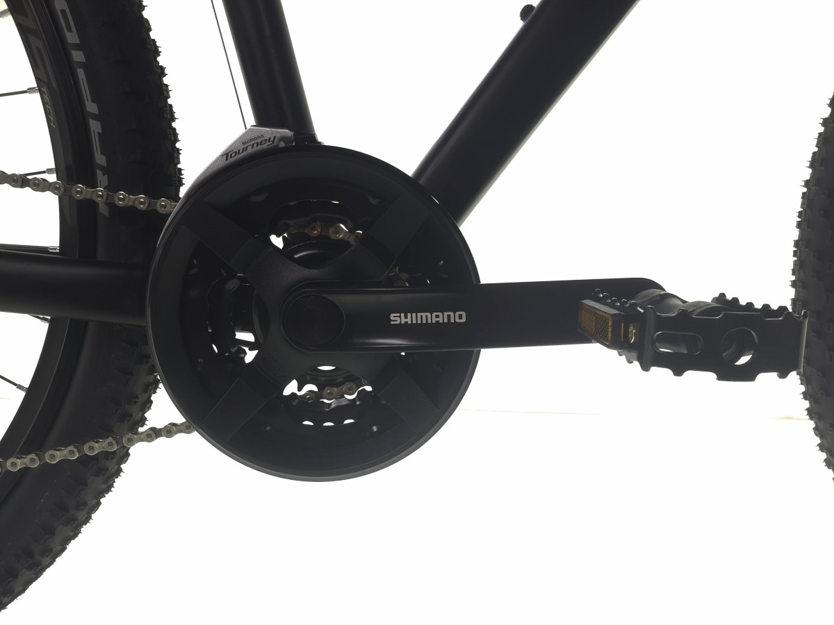 Close-up of Shimano bicycle crankset and pedals.