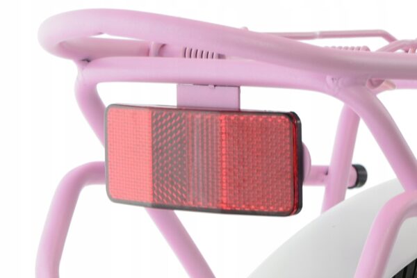 Close-up of a pink bicycle's rear reflector.