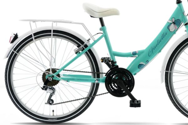 Retro cykel med vit sadel och blommönster.