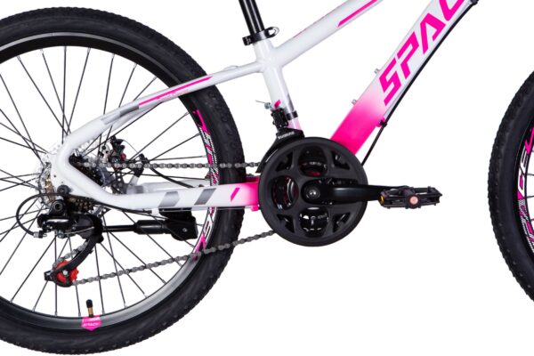Close-up of a pink and white mountain bike.
