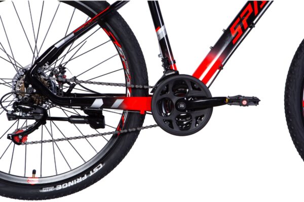 Close-up of mountain bike drivetrain and pedals.