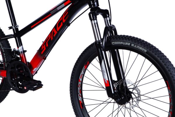 Close-up of a black and red mountain bike.
