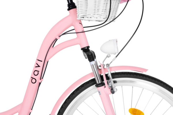 Rosa cykel med vit korg och lampa