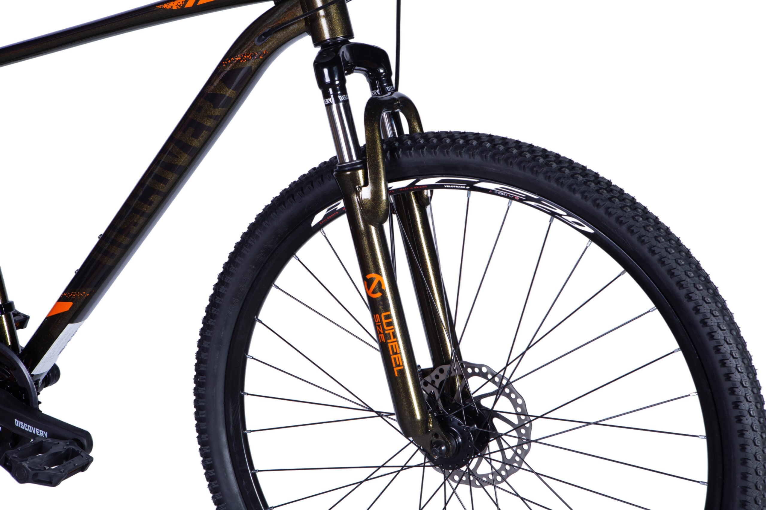 Close-up of a mountain bike's front fork and wheel.