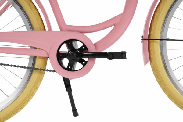 Rosa cykel med gula däck, närbild