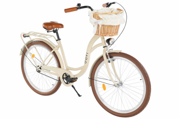 Beige cykel med korg och bruna detaljer.