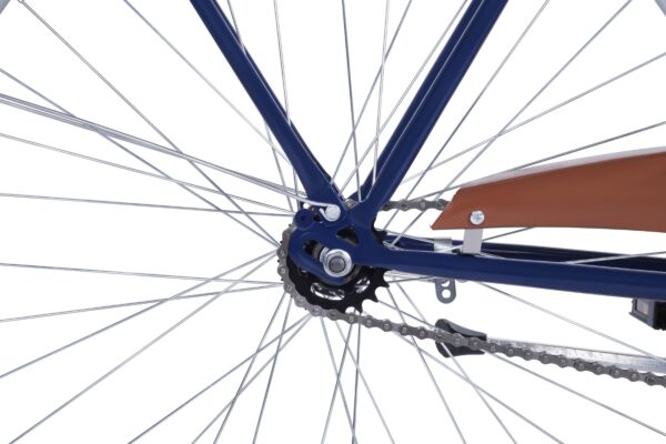 Close-up of a bicycle's chain and rear wheel.