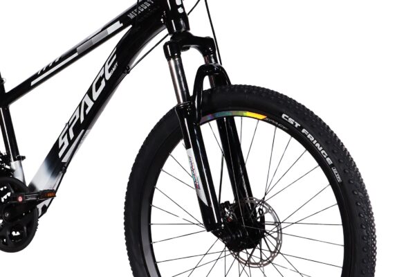 Close-up of a black mountain bike front wheel.